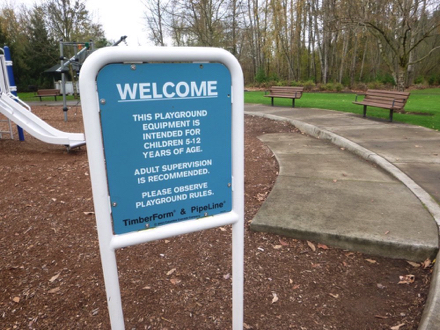Sign at playground – equipment intended for children 5-12 – adult supervision is recommend – please observe rules
